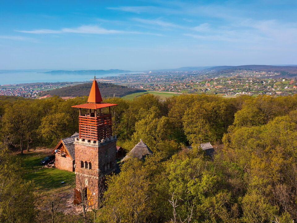 Aerial view about lookout tower on Csere mountain with lake Balaton at the background Spring landscape Hungarian name is Csere-hegyi kilato - Nők Lapja