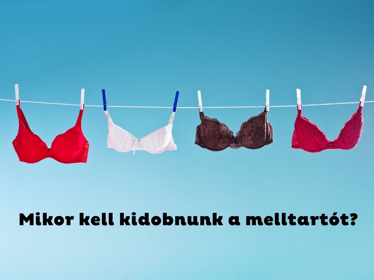 Kék égbolt, ruhaszárítóra csíptetett piros, fehér és fekete melltartók