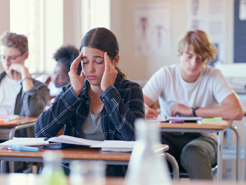 Shot of a student struggling with schoolwork in a classroom - Nők Lapja